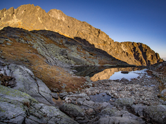 "under the mountain peaks"