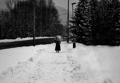 Woman is walking down the street