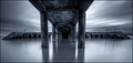Under the pier.
