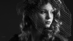Portrait of girl behind the veil
