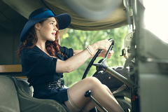 Vintage girl driving jeep