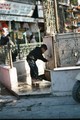 a boy having a sip of water