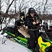 Matti Berg so svojím psom na snežnom skútri.jpg